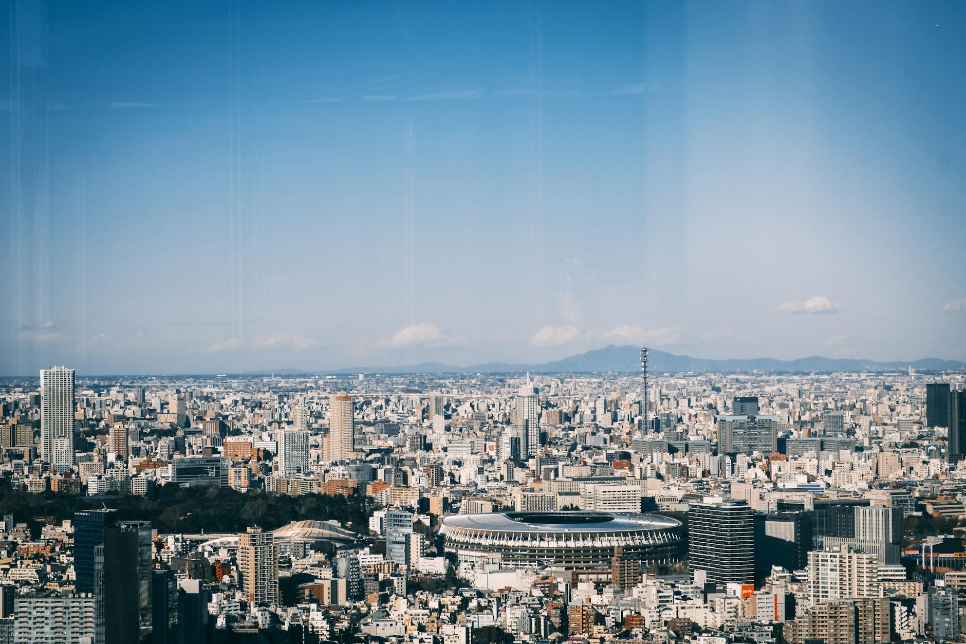 modern city architecture with various skyscrapers and towers in sunlight